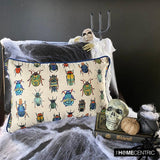 A decorative lumbar cushion cover with a blue background featuring a pattern of various colorful insects, displayed on a chair with a skeleton and Halloween decorations around it.